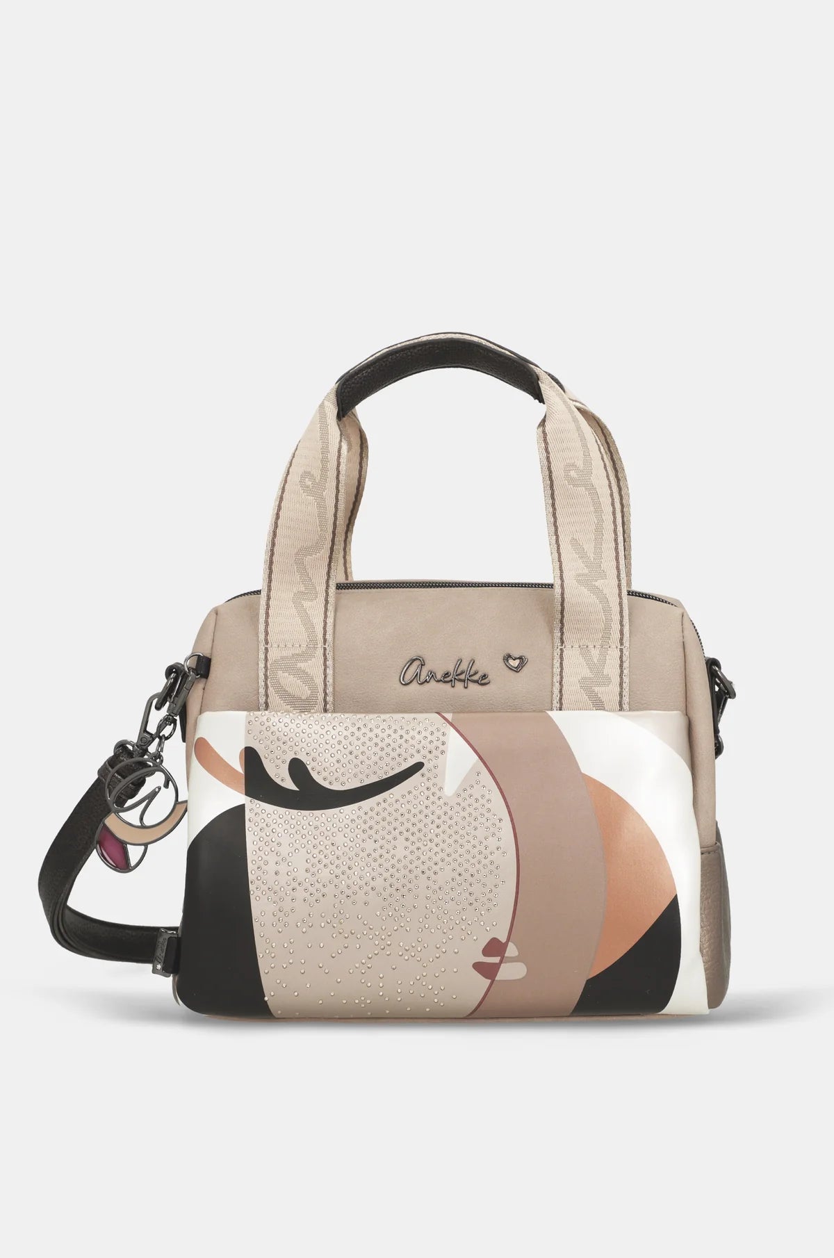 Bolso de mano Anekke Eikon con panel artístico abstracto, asas cortas de tela y bandolera negra ajustable.